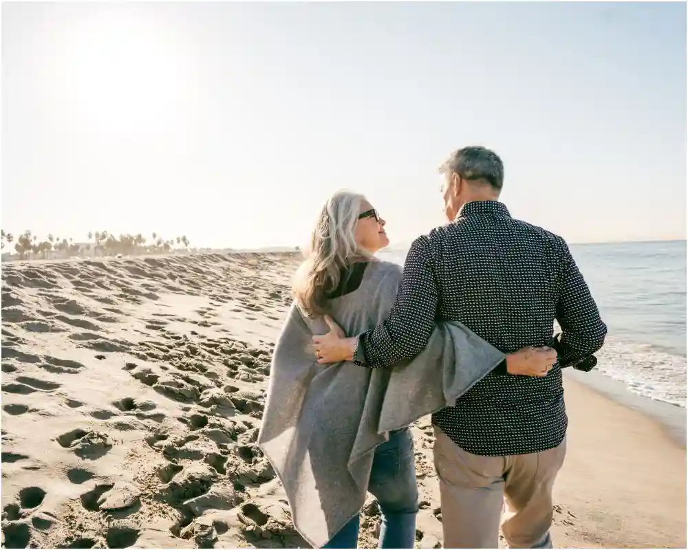 Senior couple walking on the beach