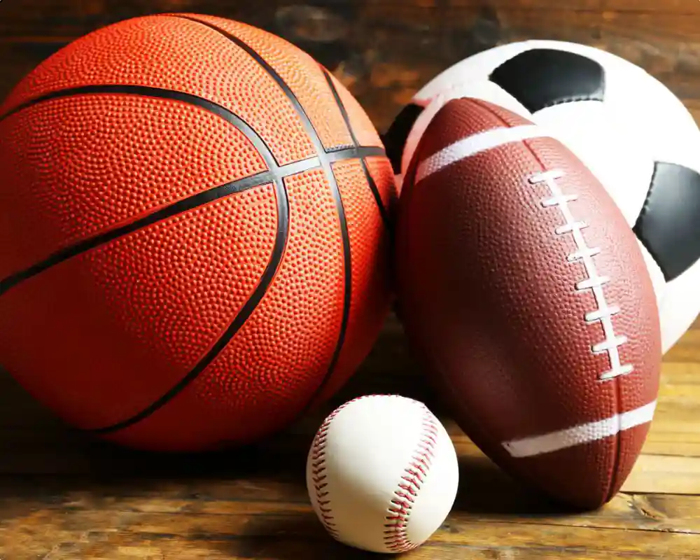 close up of a basketball, football, baseball and soccer ball