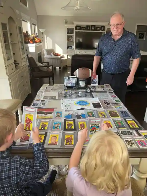 Sports cards, autographs and other memorabilia on a table.