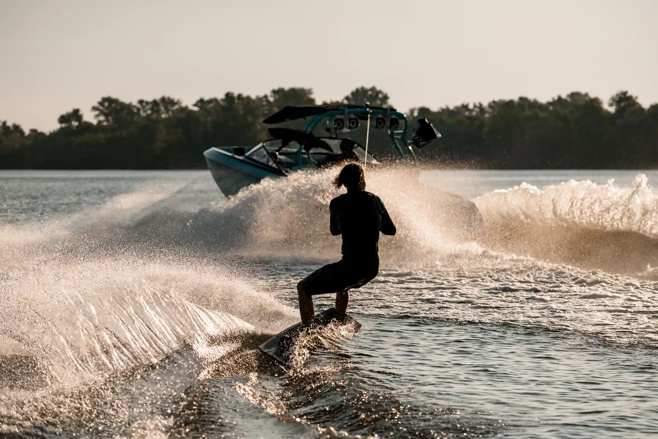 Skier being pulled behind a boat.