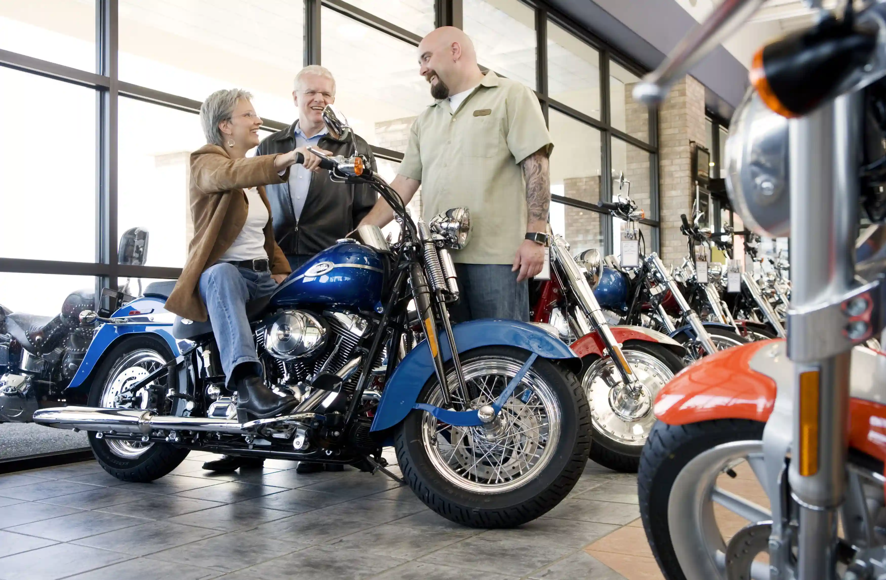 Older couple shopping for motorcycles.