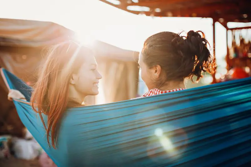 Two women relaxing in a hammock