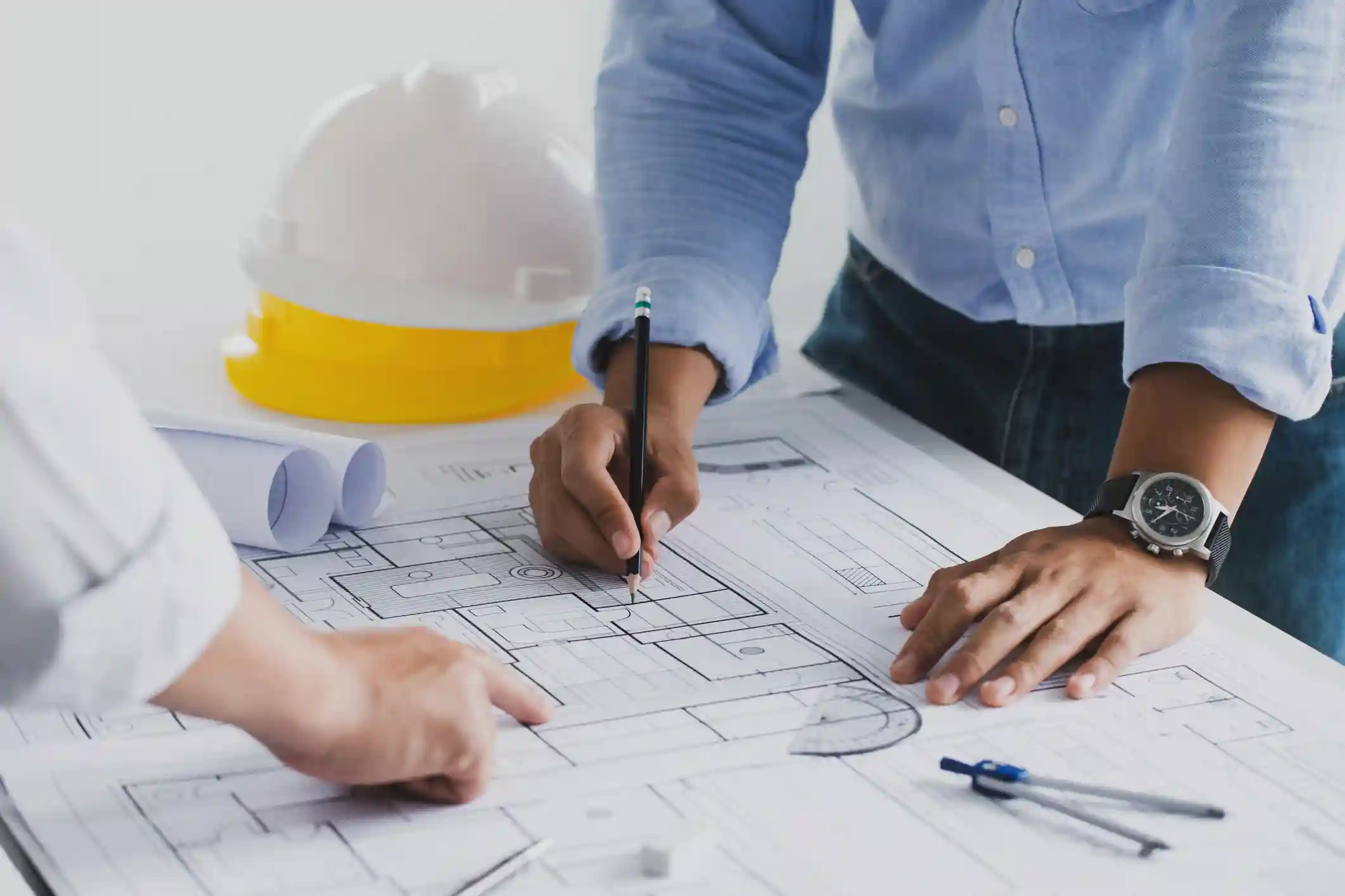 Architects reviewing blueprints.